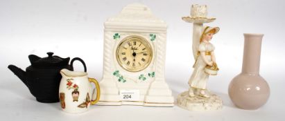 A collection of china to include a Belleek clock,