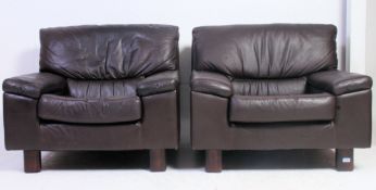A pair of original Tetrad retro leather brown armchairs raised on squared supports with angular