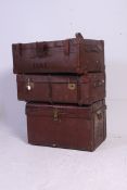2 vintage canvas and wooden / leather strapped steamer trunks, both with hinged centres,