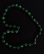 A malachite bead necklace with believed 9ct gold spacers ( af ) Please note: Gold spacers seem to