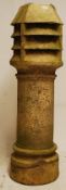 A very large Victorian stoneware chimney pot, tall round stem with fluted vented top. 120cm tall.