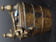 A set of eight bronze measuring cups stacking cup weights,