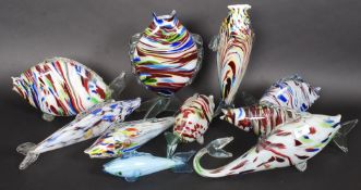 A large quantity of coloured Murano glass fish of various shapes and sizes.