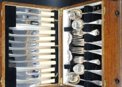 A good quality oak cased 48 canteen of cutlery by Viners set within an oak case with pull out