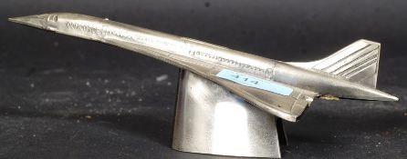 A 20th century cast metal advertising statue / paperweight in the form of Concorde primed for