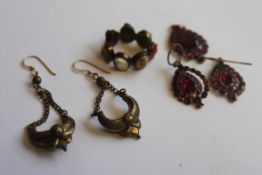 A Victorian yellow metal and ruby garnet stone inset earrings and necklace pendant set together