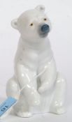 A Lladro figurine ' Sad Polar Bear Sat Down on Haunches ' Bearing  blue stamp to base.