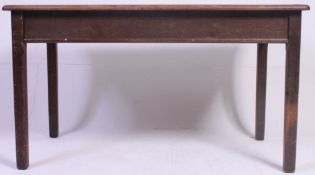 A early to mid 20th century farmhouse kitchen / dining table raised on squared legs with fitted