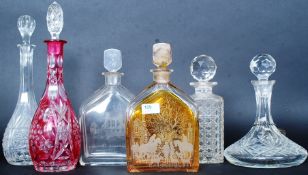 A collection of 5x crystal and glass drinks decanters, each with original stopper.