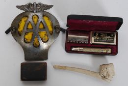 A mixed lot to include a clay pipe, snuff pot and vintage AA car badge,