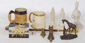 A box of horse racing collectables to include onyx bookends, figures, brass horse shaped hooks,