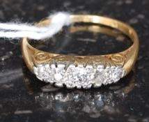 An 18ct gold and diamond ring having central set 5 stones approx .50pnts total weight 3.1g.