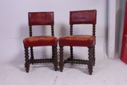 A pair of Victorian barleytwist and red leather jacobean revival dining chairs.