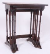 A good quality reproduction mahogany and leather graduating nest of tables,