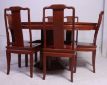 A large Chinese hardwood pedestal dining table together with the 6 Chinese dining chairs having