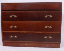 A 1940's post war gentlemans oak chest of drawers having a series of drawers to the chest with the
