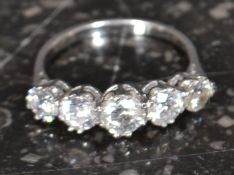 An 18ct white gold five stone diamond ring, 1.61cts exact weight.