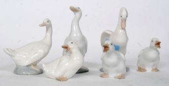 A collection of 6 Nao duck figurines.