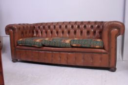 An antique style tan leather button back Chesterfield sofa settee.