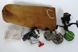 A collection of vintage fishing reels to include fly and others