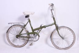 A vintage Raleigh 1980's folding ladies bicycle bike having good condition original green metallic