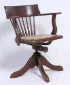 A 1930's solid oak Industrial captains office swivel desk chair,