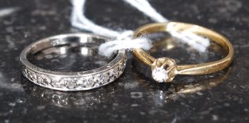 2 18ct gold diamonds rings, one with central solitaire mount, the other being half eternity.