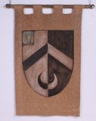 An unusual large handpainted Coat of Arms  on Hessian - wall hanging being mounted to a brass