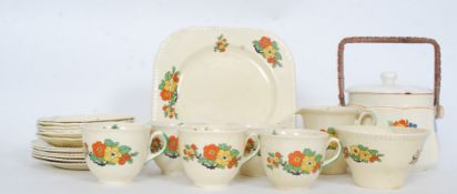 A art deco twenty piece tea service consisting of six cups, six saucers, six side plates,