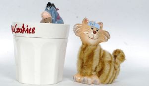 Bosson's wall plaques along with a Eeyore cookie jar and a fur covered money box.