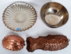 A silver plated Elkington fluted bowl along with another and two copper moulds