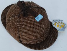 A vintage motorcycle helmet having tweed deerstalker covering together with a vintage AA motoring
