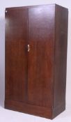 A 1930's Art Deco oak Compactom wardrobe.