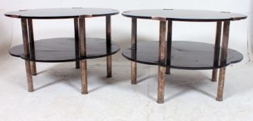 A pair of 1930's Art Deco black glass and chrome flower head shaped occasional coffee tables.