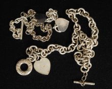 Two silver bracelets with heart shaped lockets stamped 925 along with another similar white metal