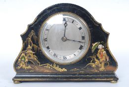 An early 20th century chinoserie decorated lacquered mantle clock,