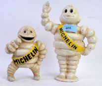 Two vintage style cast iron Michelin Man Bibendum money boxes