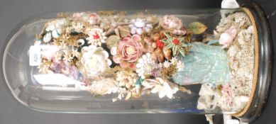 A 19th century Victorian shell diorama of a floral arrangement set under glass dome.