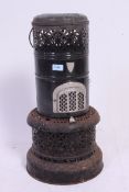 A vintage large enamel Valour greenhouse / garden heater, in typical cast iron construction,