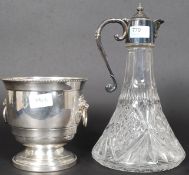 A good quality silver plate and cut glass ships claret decanter with hinged pourer together with a