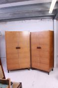 A Gordon Russell of Broadway, Worcestershire pair of oak wardrobes.