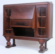 A 1930's Art Deco oak bureau bookcase cabinet.