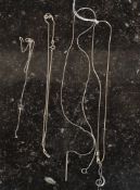A silver necklace with music note pendant together with a fine necklace with hoop and bar clasp and