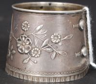 A French Art Nouveau silver bottle neck decanter label in the form of a lace cuff.