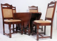 A good quality country oak antique style drop leaf dining table together with a set of 4 matching