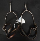 A pair of early 19th century Georgian gentlemans close plate spurs complete with the leather straps