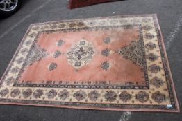 A Royal Keshan 20th century Belgian rug being 100% wool having central medallions on red/pink