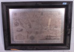 A framed Royal Geographical Society silver map of the world by John Pinches,