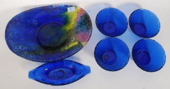 A collection of blue glass to include a pressed studio glass fruit bowl an d others please see