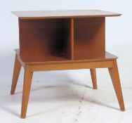 A retro 1950's coffee magazine / book rack table Canterbury of unusual form having angled tapered